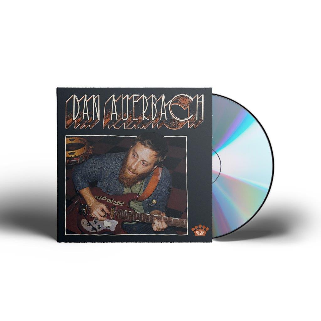 CD case with a man playing guitar on the cover, partially open.