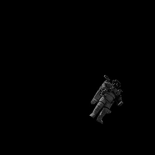 Astronaut floating in darkness, vinyl record album cover art.