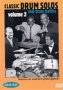 DVD cover with four men in suits around a drum kit, on orange background.