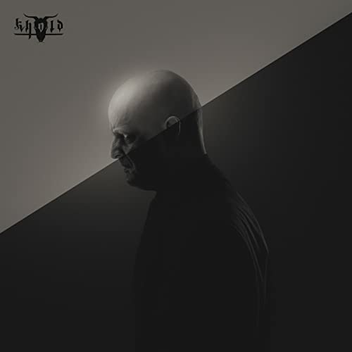 Dark album cover featuring a bald man in profile with a face covering.