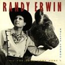 Randy Erwin in a cowboy hat and western shirt holding a cow's head.
