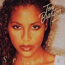 Toni Braxton’s “Secrets” CD cover featuring a close-up portrait of the singer.