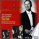 Red CD cover with black and white images of a man in a tuxedo.