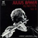 Black and white photo of a man playing the flute on a CD cover.