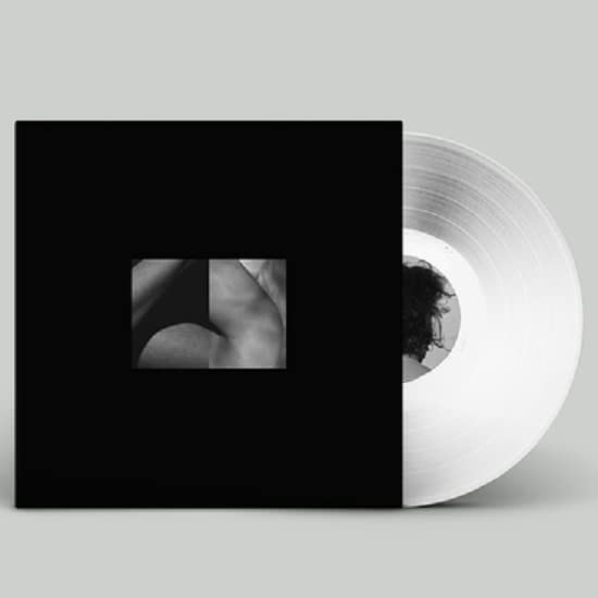 Black and white vinyl record with a close-up, abstract image on the cover.