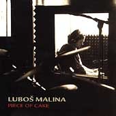 The image depicts a CD cover featuring a man playing drums in a dimly lit room.