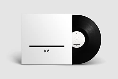 Vinyl record with a white sleeve featuring a black line and “kō” text.