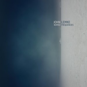 "CD cover for 'Nomad Frequencies' by John Lemke, with dark blue and white background."