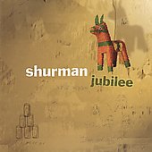 Album cover for "Shurman - Jubilee" featuring a red, green, and black donkey on beige.