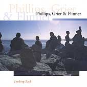 "Album cover featuring silhouetted figures on rocks by the water, with artist names displayed."