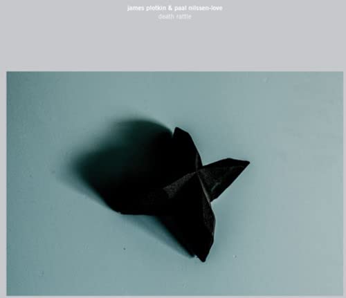 CD cover: black origami shape casting a shadow on blue background.