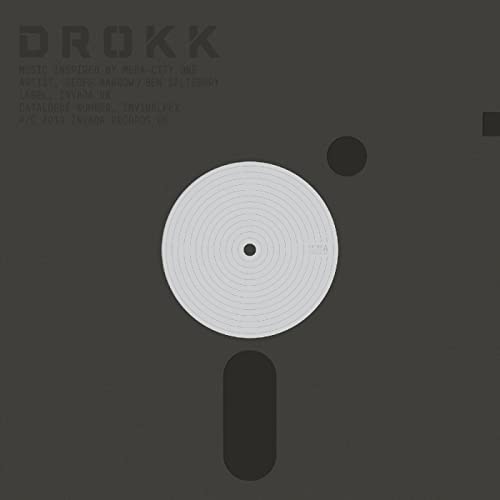 Vinyl record artwork resembling a 3.5-inch floppy disk, dark gray background.