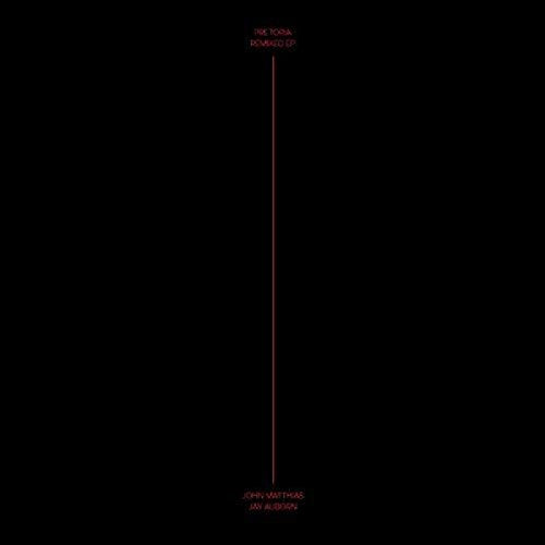 Black vinyl record cover with red vertical line and text.