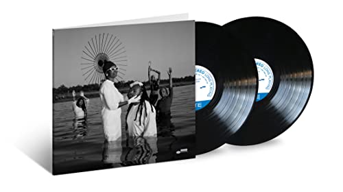 Vinyl record set with black cover featuring a group in water.