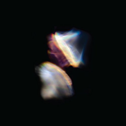 Abstract, blurred iridescent shapes on a black background; album cover art.