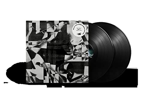 Black vinyl record and album cover with abstract black and white design.