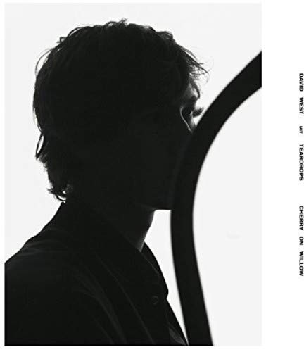 Black and white album cover featuring a silhouetted man’s face.