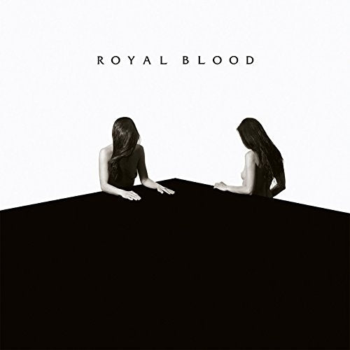 "Album cover with two women facing away from each other on a table."