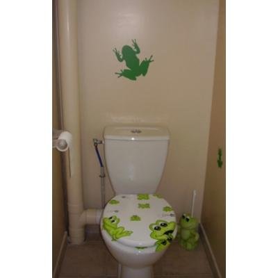 Green frog wall decal above a toilet with matching seat cover.