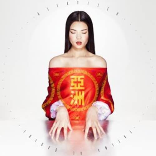 Woman in red and gold garment, centered with circular Asian characters.