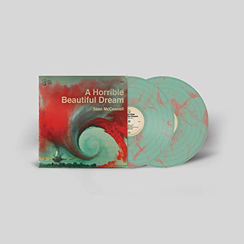 Album cover and two light green vinyl records with red marble patterns.