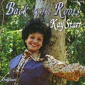 "Album cover featuring Kay Starr leaning against a tree with forest background."