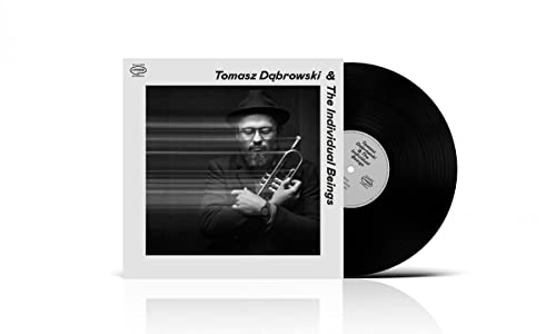 Vinyl record with album cover featuring a man playing a trumpet.