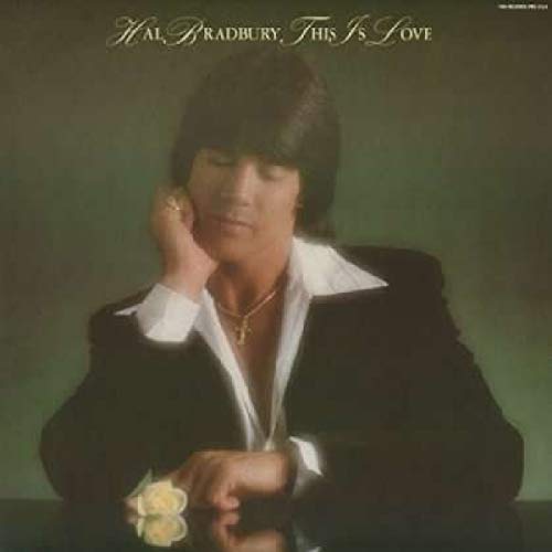 Album cover featuring a man holding a flower, wearing a black jacket and white shirt.