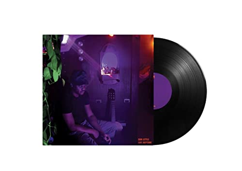 Son Little’s “Like Neptune” vinyl record with a man seated in a room.