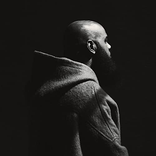 Black and white portrait of Stalley, a bearded man in a hoodie.