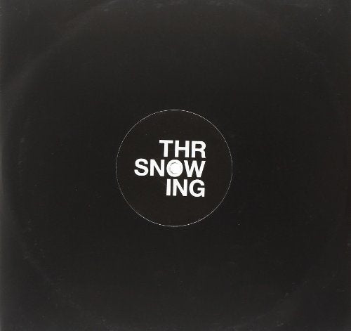 Black vinyl record cover with white text reading "THR SNOW ING" in a circle.