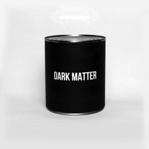 A black cylindrical CD case with "DARK MATTER" in white text on a white background.