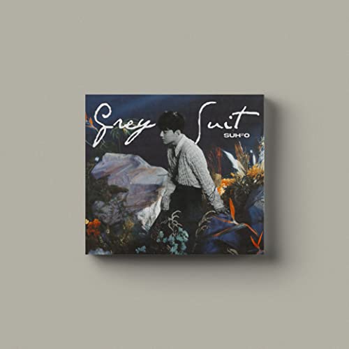 Suho in a grey suit, with floral background, album cover.