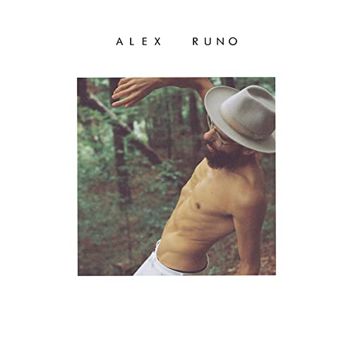 Album cover: shirtless man with hat in a forest scene.