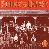 "Album cover with red-toned vintage photograph of a large group on a porch."