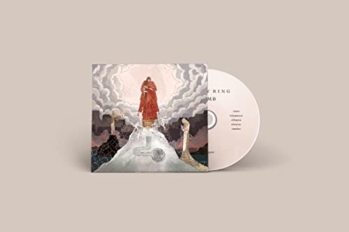 Purity Ring “Womb” CD case and disc with surreal, cloudy artwork.