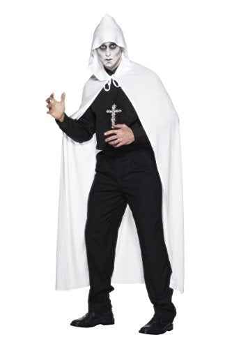 A man dressed in a white hooded cape, black clothing, and holding a cross.