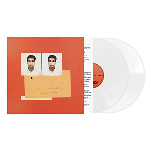 White vinyl record with orange album cover featuring two portrait photos.