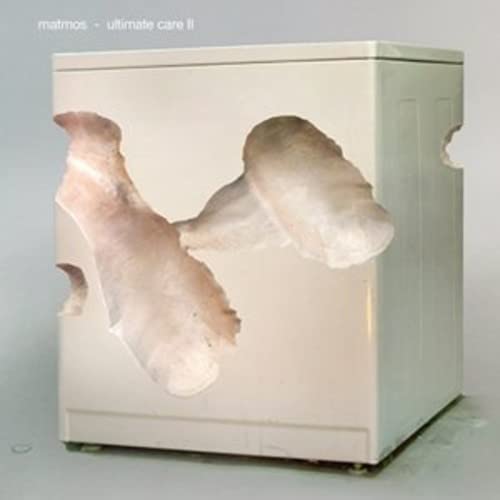 CD cover: a white washing machine with fleshy growths attached.
