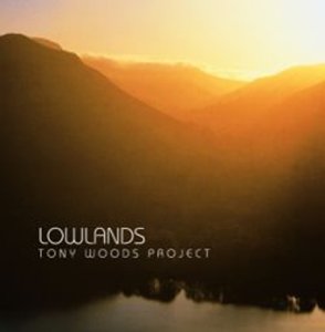 CD cover for "Lowlands" by Tony Woods Project, with a sunset mountain scene.