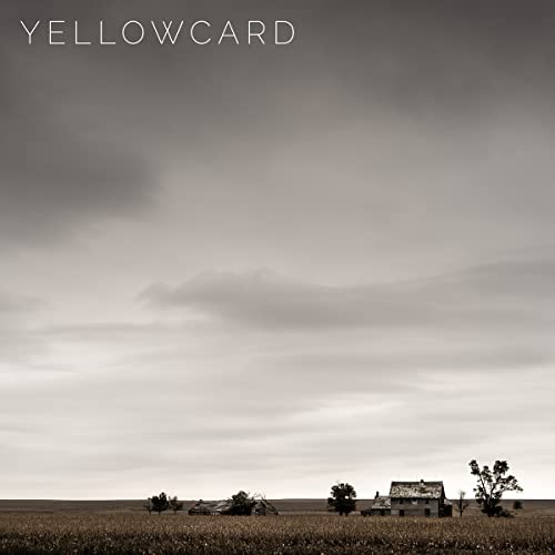 Yellowcard album cover: a desolate landscape with a farmhouse under cloudy skies.