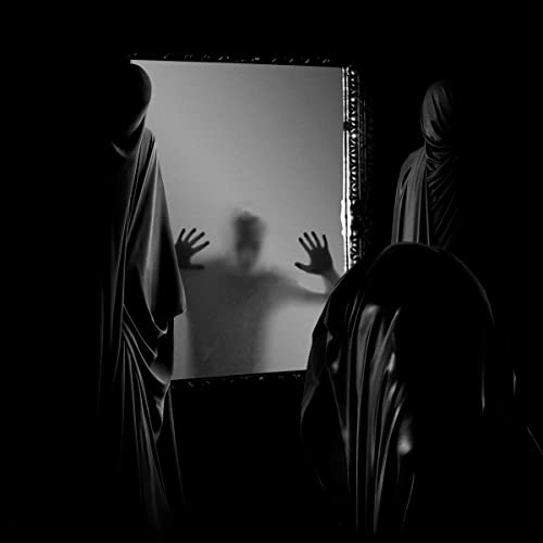 Hooded figures stand around a blurred person reaching toward a mirror.