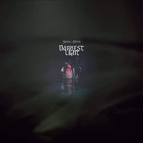 "Album cover with dark background, glowing figure, and 'Shana Falana - Darkest Light' text."