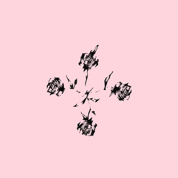 Black floral arrangement resembling a cross on a pale pink background.