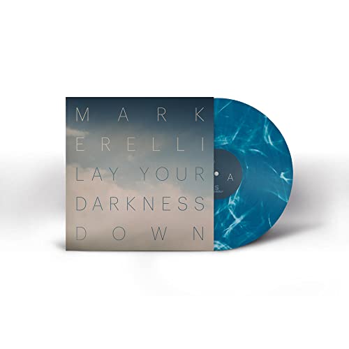 Vinyl record with blue swirl pattern and album cover with text.