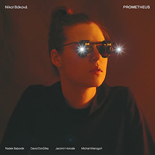 CD cover featuring a woman with sunglasses reflecting bright light.