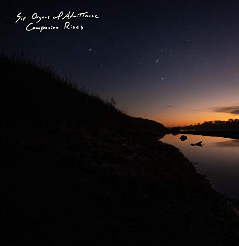 Night landscape with a river, stars, and album title text.