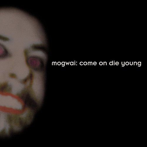 A CD album cover featuring a blurred face and white text on a black background.
