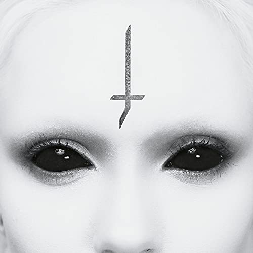 Close-up of pale face with an inverted cross on the forehead.