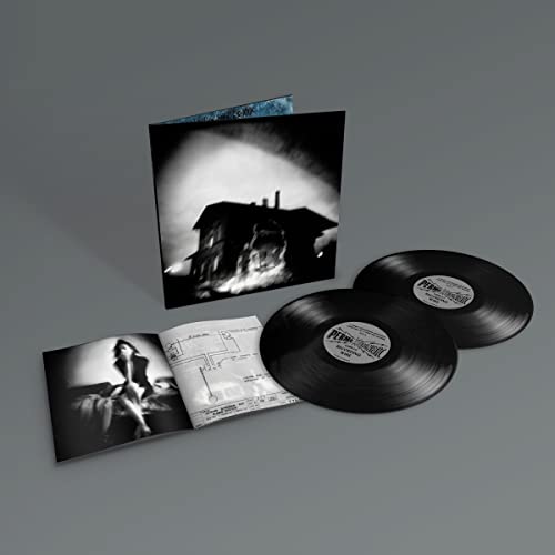 Vinyl record set with gatefold cover, two black discs, and an illustrated booklet.